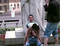Cute teen girl fucked by 2 guys in PUBLIC in center of the city by famous statue