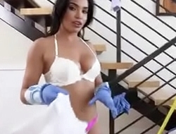 What what is her name? Cleaning house in blue shorts.